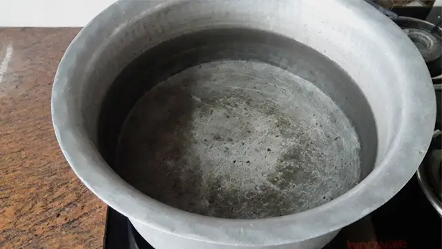 put water on the pot on gas stove